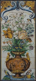 Polychrome tile picture, decorated flower vase, above two birds, down bird at bunch of grapes and pomegranate, tile picture