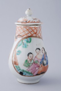 White milk jug with woman, man and child, five figures in landscape and on lid landscape, milk jug holder tableware ceramics