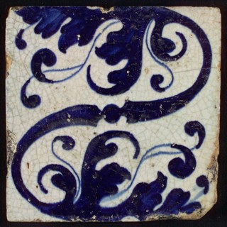 Tile, blue on white, diagonally an S-shaped volute and stylized leaf ornaments, tile picture footage fragment ceramics pottery