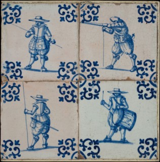Tile field, four tiles, figure decor, blue on white, all soldiers, one with drum, corner design voluut, tiled field wall tile