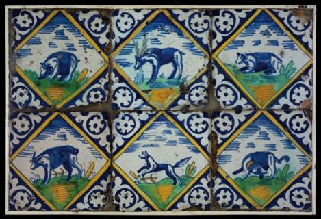 Tile field, six tiles, with animal decor in squared, orange, yellow, green and blue on white, including deer and two dogs, one