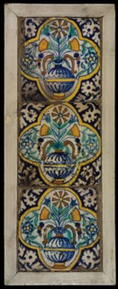 Tile field, three ornament tiles, yellow, orange, green and blue on white, flowerpot in quatrefoil, corner pattern palmet, tiled