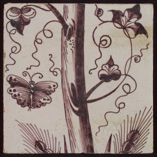 Tile of purple pilaster with tree trunk with curled twigs, leaves, bunches of grapes and around it butterflies and ears of corn