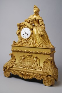 E. Ls., Gilded bronze pendulum with female figure in frock with waistband, pendulum clock timepiece measuring instrument bronze