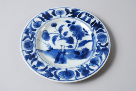 White dish with blue Oriental figure and flowers, dish plate tableware holder ceramic porcelain glaze, baked painted glazed