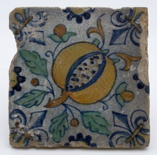 Tile with polychrome pomegranate, fleur de lis as corner decoration, tile sculpture wall tile soil find ceramic earthenware