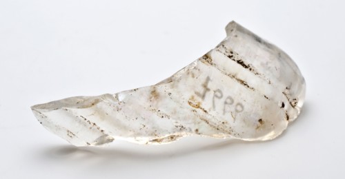 Small fragment of drinking glass with fine ribs, clear glass, goblet drinking glass drinking utensils tableware holder soil find