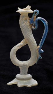 Trunk of drinking glass consisting of twisted curl and blue ear on one side, drinking glass drinking utensils tableware holder