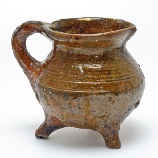 Small pottery cooking jug on three legs, sausage ear and pouring lip, glazed, grape cooking pot tableware holder kitchenware