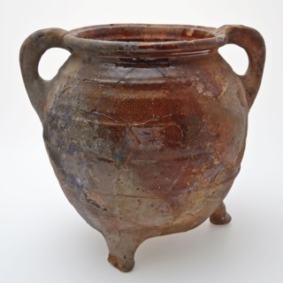 Large pottery grape on three legs, two sausage ears, ovoid with four ribs over the belly, grape cooking pot crockery holder