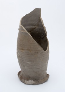 Fragment stoneware jug on pinched foot with slightly curved body and cylindrical neck, pot jug jug crockery holder fragment soil