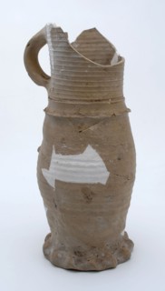 Fragment stoneware jug on pinched foot with slightly curved body and cylindrical neck, jug jug crockery holder fragment soil
