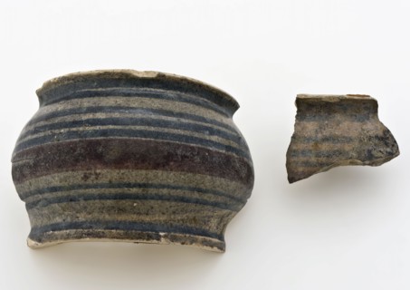 Fragments of majolica ointment jar with polychrome decor, low stomach model, ointment jar apothecary jar holder fragment soil