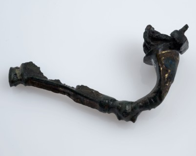 Bronze fibula or mantle pin decorated with enamel, part of the needle remains, fibula fastener soil find bronze metal enamel