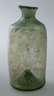 Small cylindrical bottle with round shoulder and slender, short neck, bottle holder soil find glass h 9.4 free blown Small