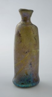 Small cylindrical bottle with round shoulder and narrow neck, bulging foot, bottle holder bottomfound glass, free blown Small