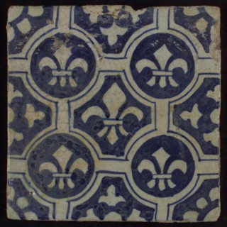Two-tone tile, blue on white background, four circles with white French lily around central ornament with lily, wall tile