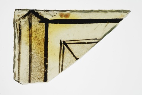 Corner fragment of green window glass with stained-glass decor, plinth or frame, window glass building material soil find glass