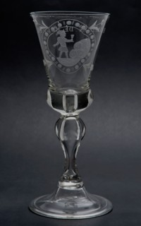 Chalice glass engraved with cartouche, child with glass by pile of barrels and Hansie in the cellar, wineglass drinking glass