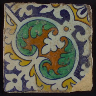 Ornament tile, central kidney-shaped green and brown floral shape, corner motifs, quarter rosette and saving technique, wall