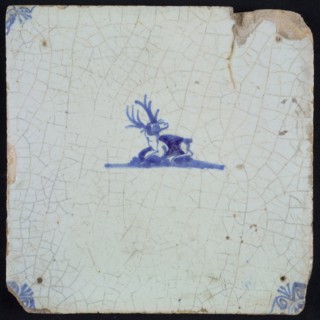 Animal tile with lying deer, small and blue decor on white ground, corner filling ox's head, wall tile tile sculpture ceramic
