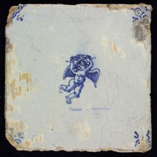 Wijtmans, Figure tile with angel and wreath, blue decor on white ground, corner filler ox head, marked, wall tile tile sculpture
