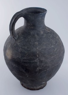 Large dark gray jug on slightly pinched stand ring, tableware holder earthenware ceramic pottery, hand-turned baked Large dark