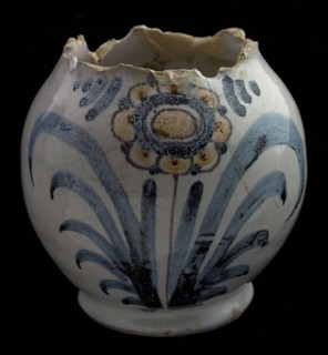 Fragment of faience jug, on which polychrome flower, schertskan, vase holder soil found ceramic earthenware glaze tin glaze