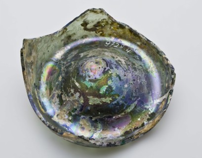 Fragment of foot and rim of bottle or jug, bottle holder soil found glass forest glass, free blown and formed Fragment of bottom