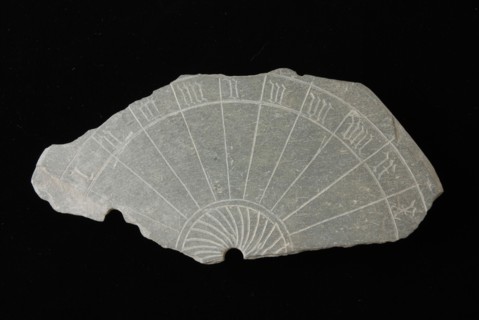 Fragment sundial, slate disc with incised Roman numerals, sundial clockwork measuring instrument fragment soil found slate stone