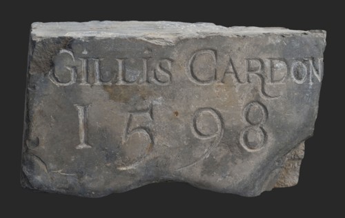 Stone with text Gillis Cardon 1598, tombstone? facing brick? building component? slate stone, chopped Rectangular text