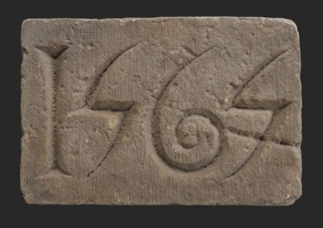 Facade stone with date 1565, Dominican monastery, facing brick foundation stone building component sandstone stone, minced