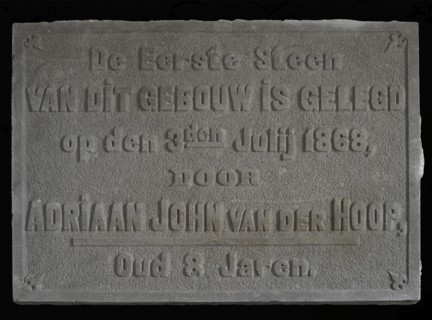 Facade stone with text The first stone ... Van der Hoop ... 1868 ... 8 years, facing brick first stone building part stone