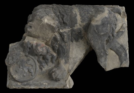 Fragment of facing brick, lion resting on tons, on which lion, facade stone sculpture sculpture building component sandstone