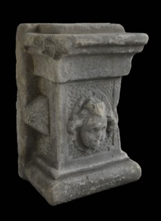 Basement with female head, basement ornament building component sandstone stone, sculpted Rectangular basement with woman's head