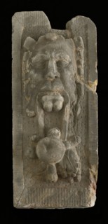 Cornerstone with gable head, satyr with fruit, keystone gable ornament building component sandstone stone, sculpted