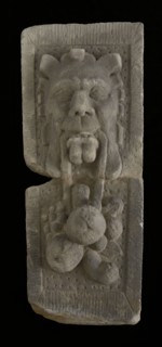 Cornerstone with gable head, satyr with fruit, keystone gable ornament building component sandstone stone, sculpted
