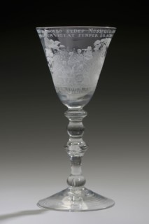 Goblet engraved with Apollo and the nine muses and opposite the statue of Erasmus, wineglass drinking glass drinkware tableware