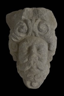 Console with male head, console building element sandstone stone, sculpted Console with male head surrounded by curls