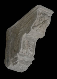 Console with dog's head (with horns) and leaf motifs, console building element sandstone stone, sculpted Console