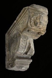 Console with child's head, console building element sandstone stone, sculpted Console with at the top and bottom side edges band