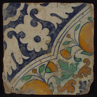 Ornament tile, diagonal ornament in quatrefoil with bows in which orange-apples and flowers, palm corner, corner motif rosette