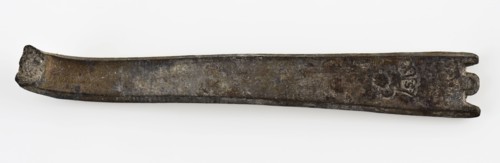 Broken flat handle of spoon, with two notches at the end, spoon cutlery soil find tin metal, cast Flat handle with round tip