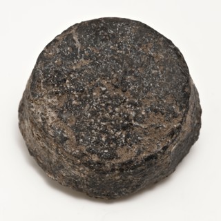 Flattened slightly conical lead weight, weight soil finding lead metal, gram cast Conical weight topside oblique.