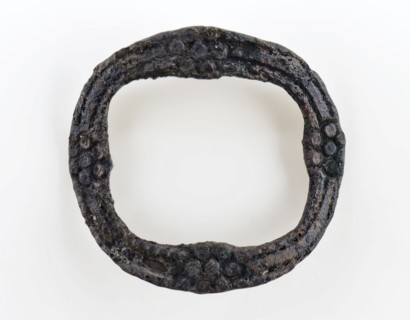 Small graceful buckle, oval and decorated with rosettes, buckle fastener component soil find copper tin? metal, Oval bracket