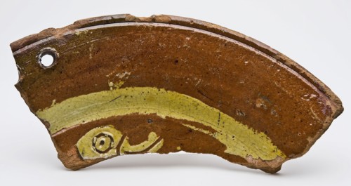 Fragment of earthenware dish on stand fins with bird's head in sludge technology, dish crockery holder soil find ceramic
