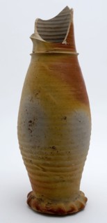 Stoneware jug with gray and brown color, on squeeze foot, jug be found bottom ceramic stoneware, hand-turned baked Gray