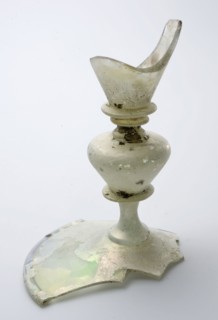 Fragment of part of the foot, trunk and part of the goblet of chalice in clear colorless glass, drinking glass drinking utensils