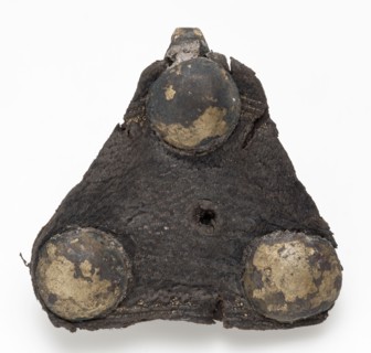 Triangular riveted piece of batter with hook and remnant leather, fitting closure soil finding brass leather metal, whipped