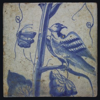 Blue tile with looking bird on grape leaf, butterfly, of chimney pilaster with 13 tiles, tree of bunches of grapes with birds